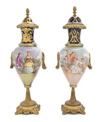 A Pair of Sevres Style Gilt Metal Mounted Porcelain Urns, Height 12 7/8 inches