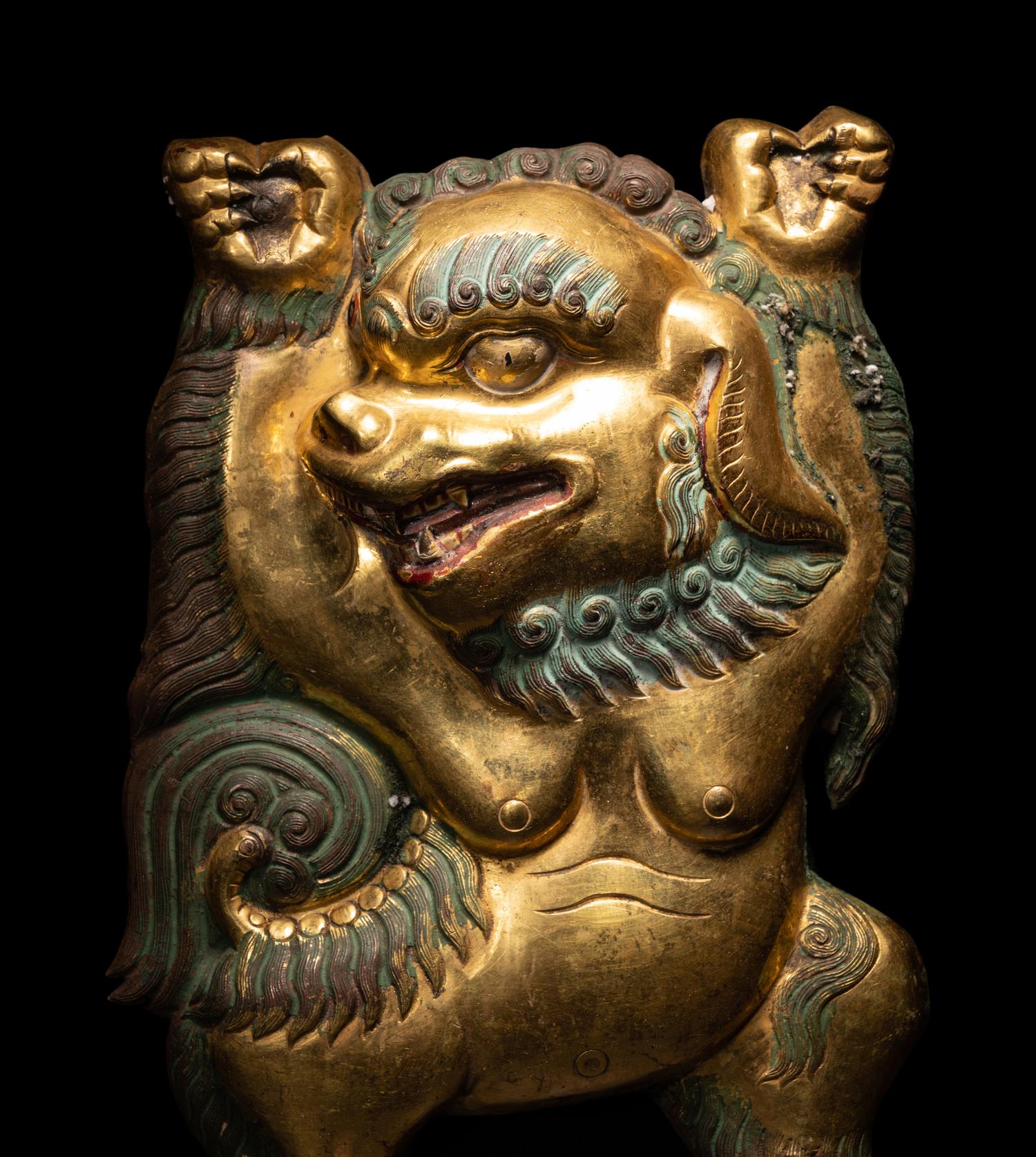 A Sino-Tibetan Gilt Bronze Repoussé Fu-Lion