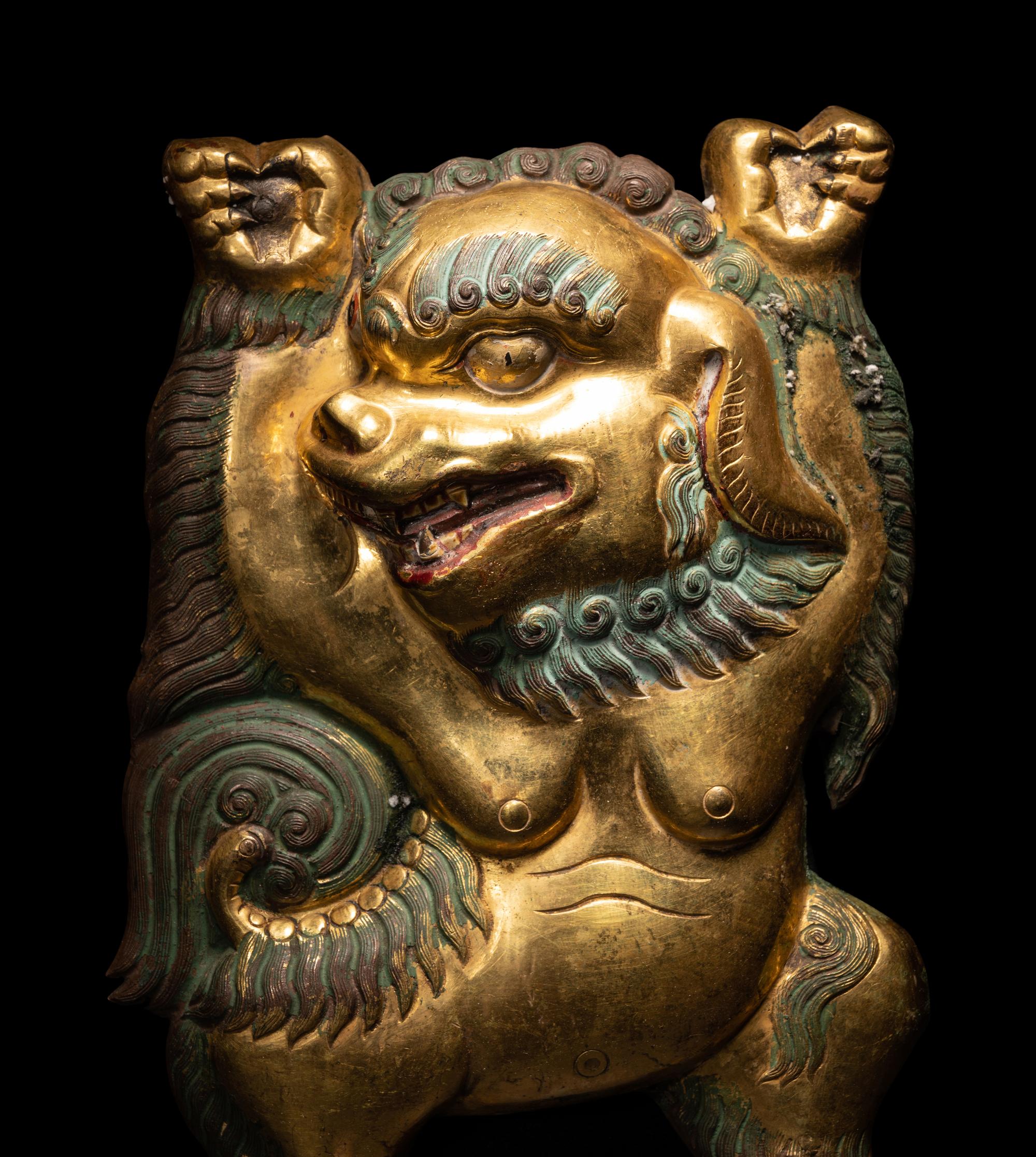 A Sino-Tibetan Gilt Bronze Repoussé Fu-Lion