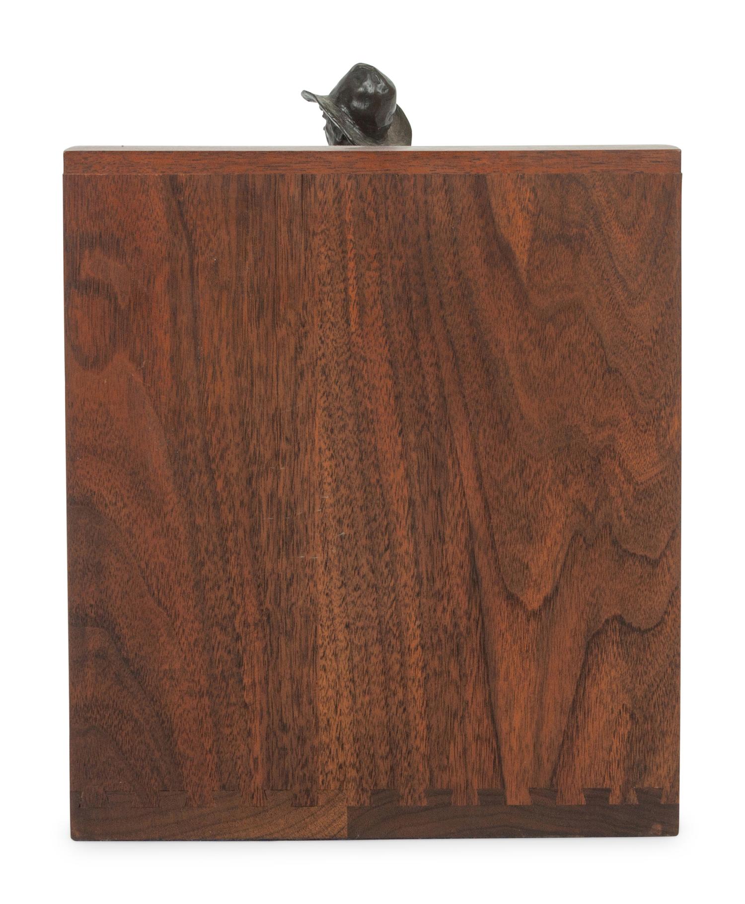 The Bronc Rider , edition 23/100, mounted as bookend; together with book, From Broncs to Bronzes: The Life and Work of Grant Speed by Don Hedgpeth