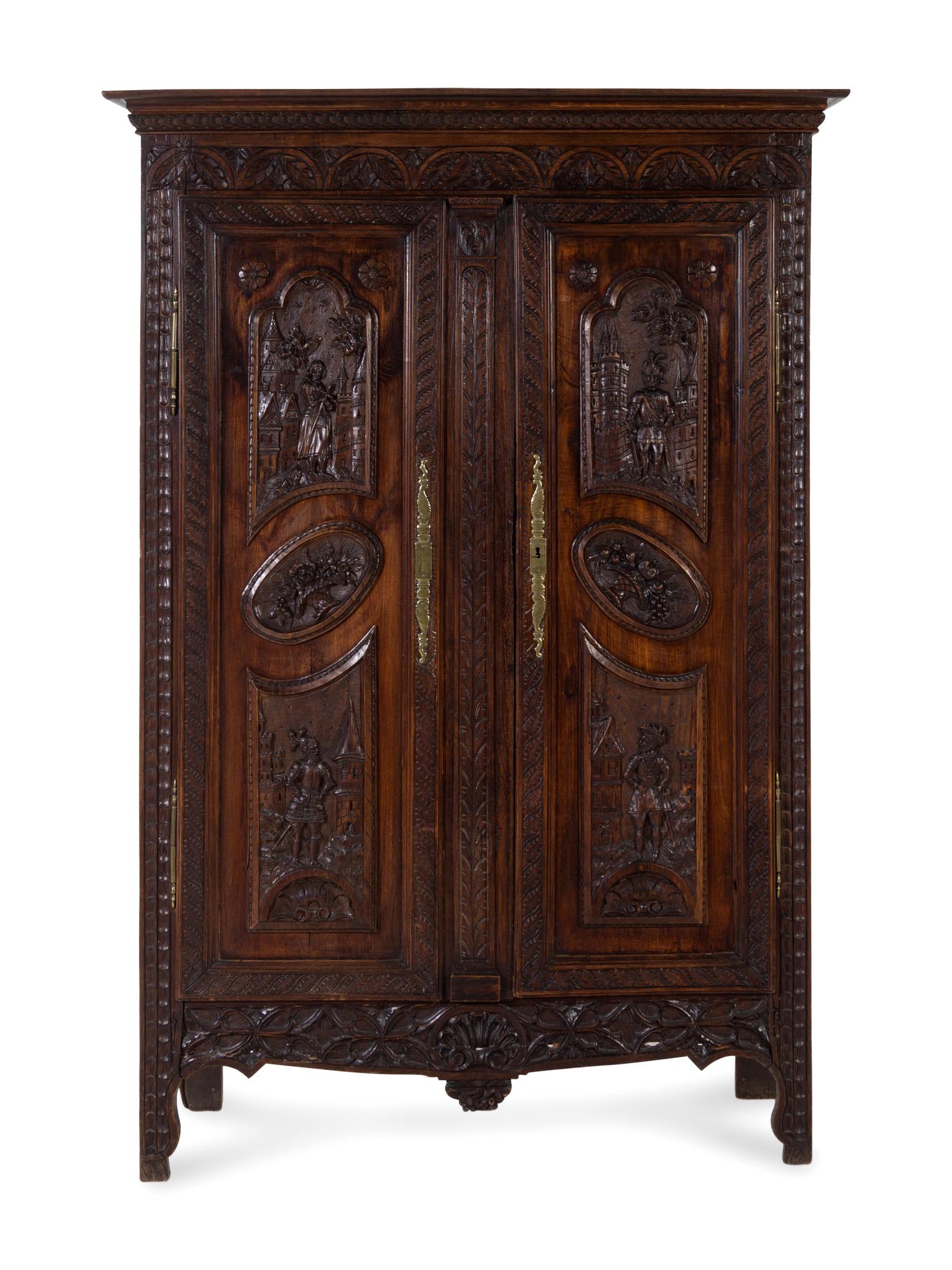 A Brittany Style Carved Oak Armoire