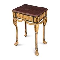 A Neoclassical Style Gilt Bronze Mounted Parcel-Gilt, Ebonized and Porphyry-Top Center Table