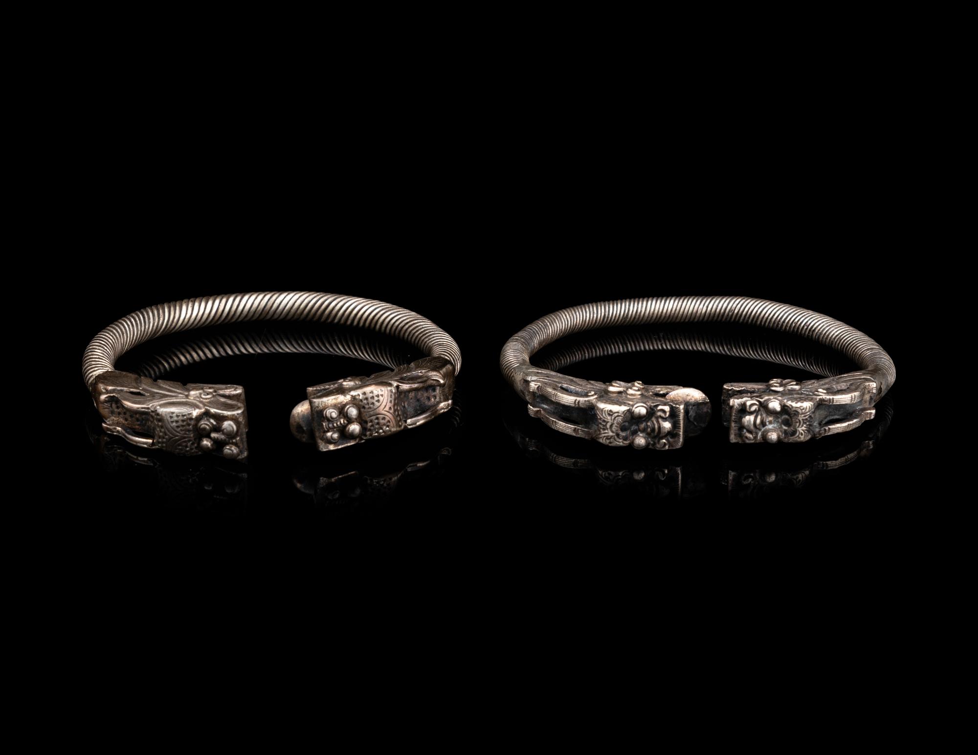 A Pair of Chinese Silver 'Dragon' Bangles