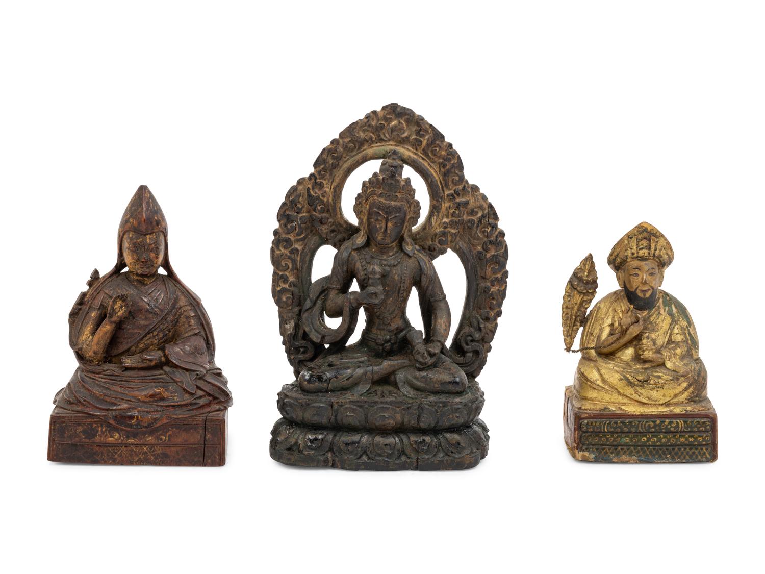 Three Sino-Tibetan Carved Wood Seated Figures