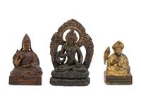 Three Sino-Tibetan Carved Wood Seated Figures