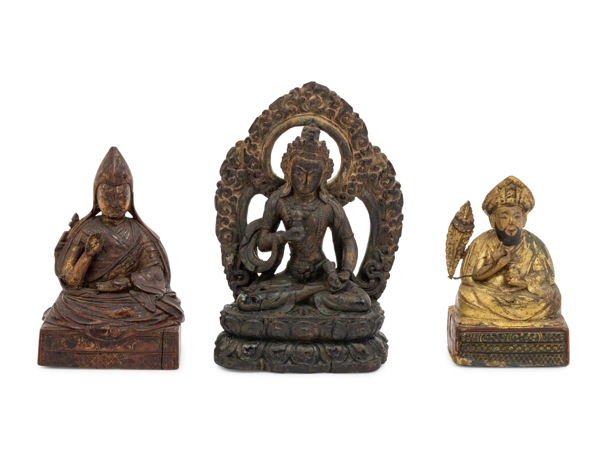 Three Sino-Tibetan Carved Wood Seated Figures