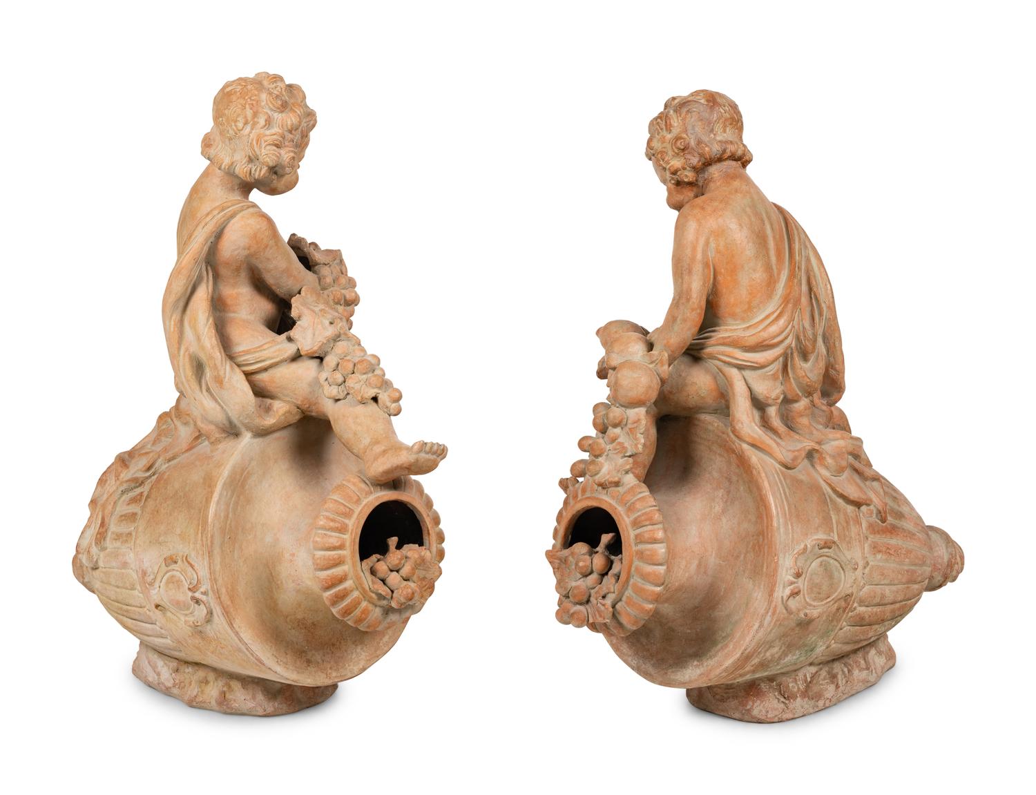 A Pair of Terra Cotta Putti Ornaments
