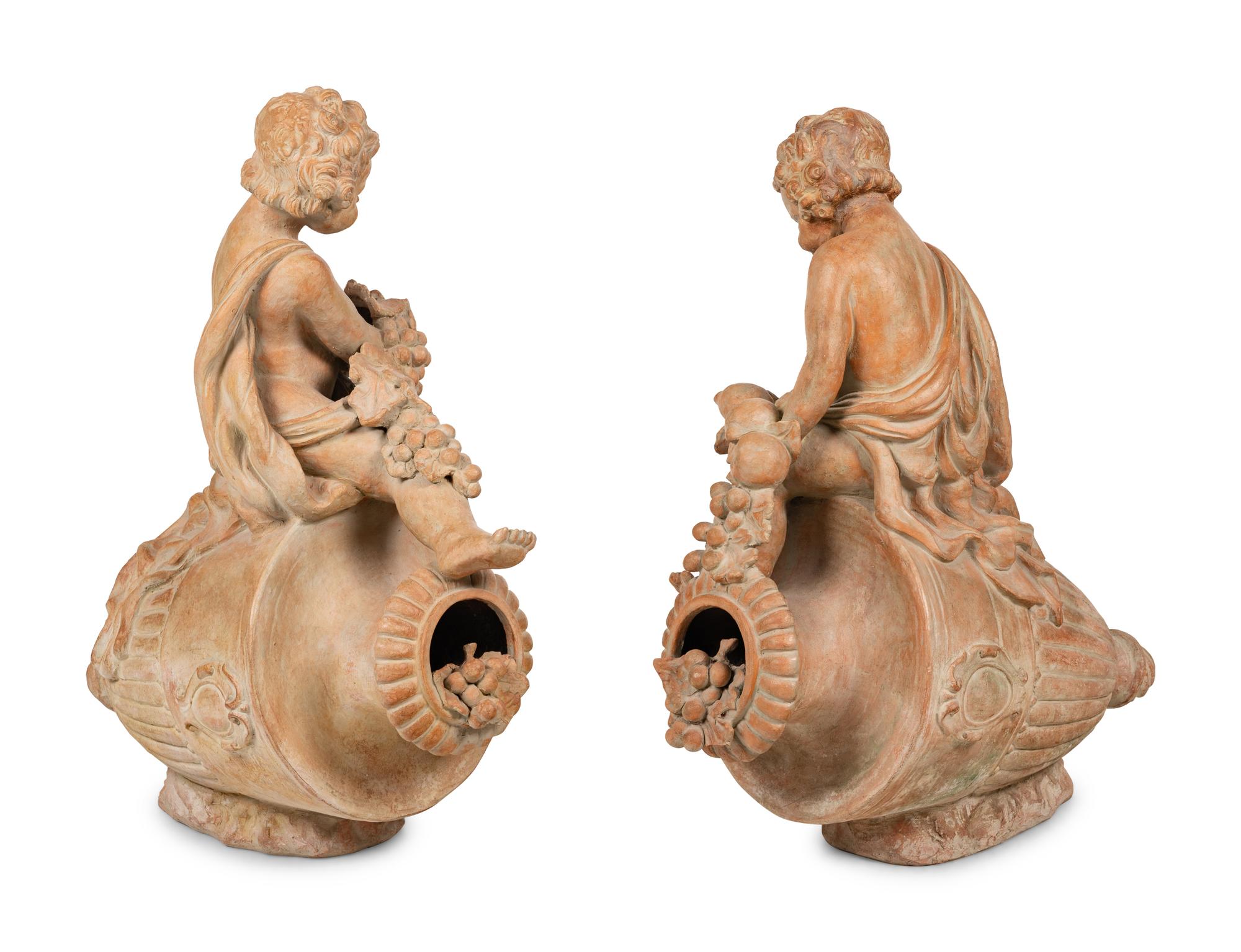 A Pair of Terra Cotta Putti Ornaments