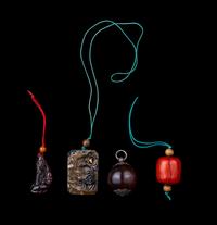 Four Chinese Amber, Agate, Coral and Hardstone Pendants
