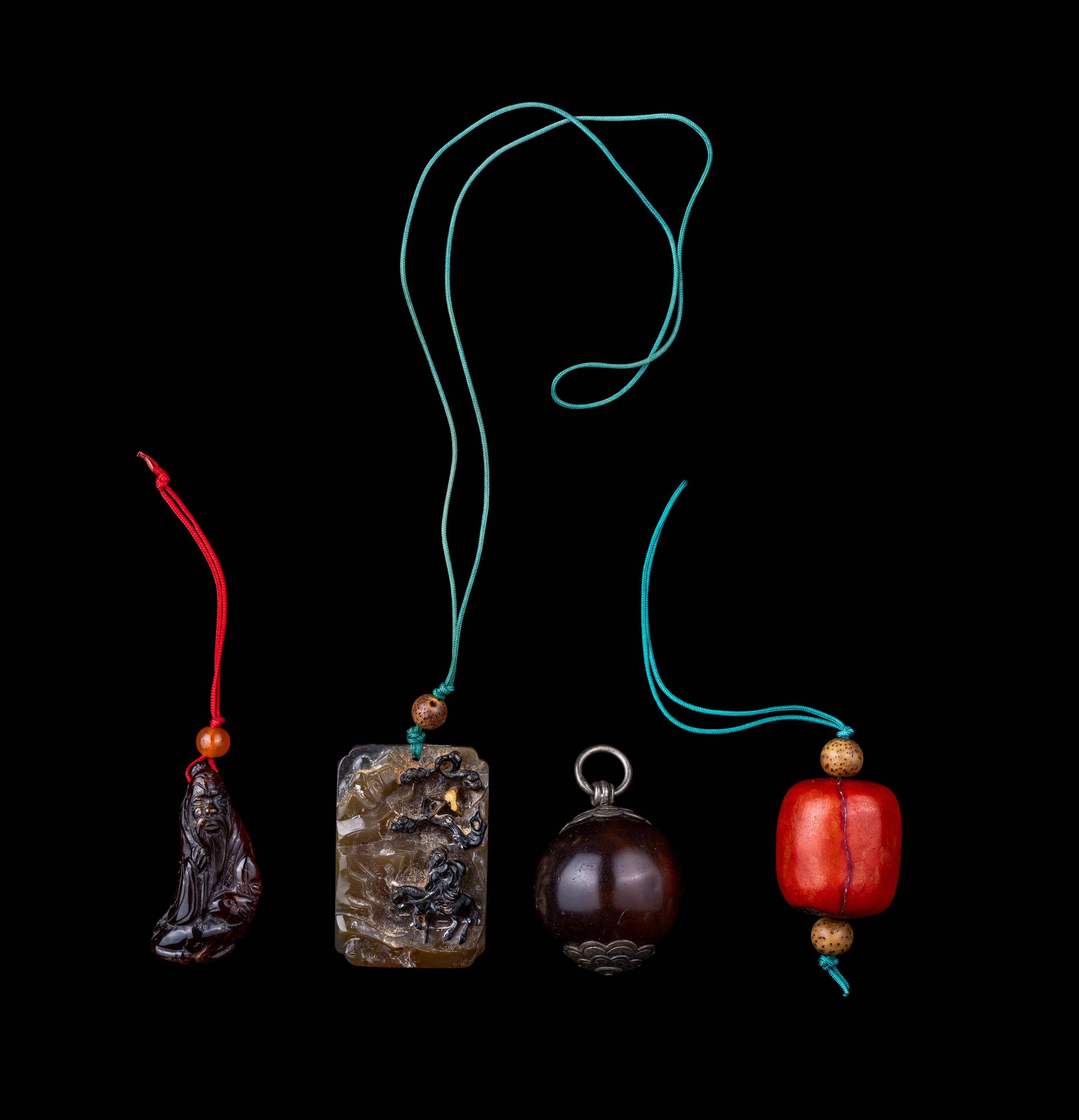 Four Chinese Amber, Agate, Coral and Hardstone Pendants