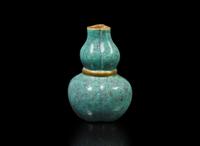 A small Chinese "Robin's-Egg"-glazed molded lobed double-gourd cabinet vase, Qing dynasty 爐鈞釉小葫蘆瓶 清