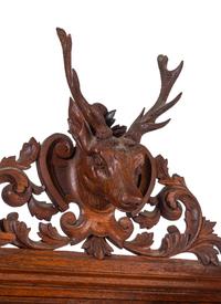 A Black Forest Style Carved Oak Serving Cabinet
