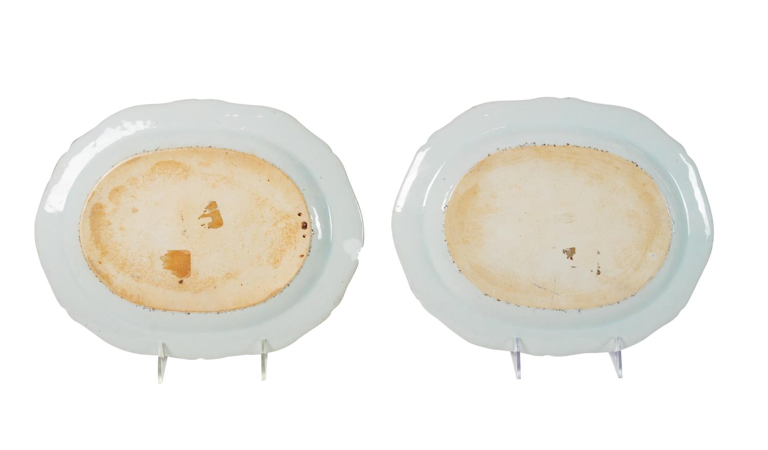 A Pair of Chinese Export Porcelain Armorial Platters Raised on Later Mahogany Stands