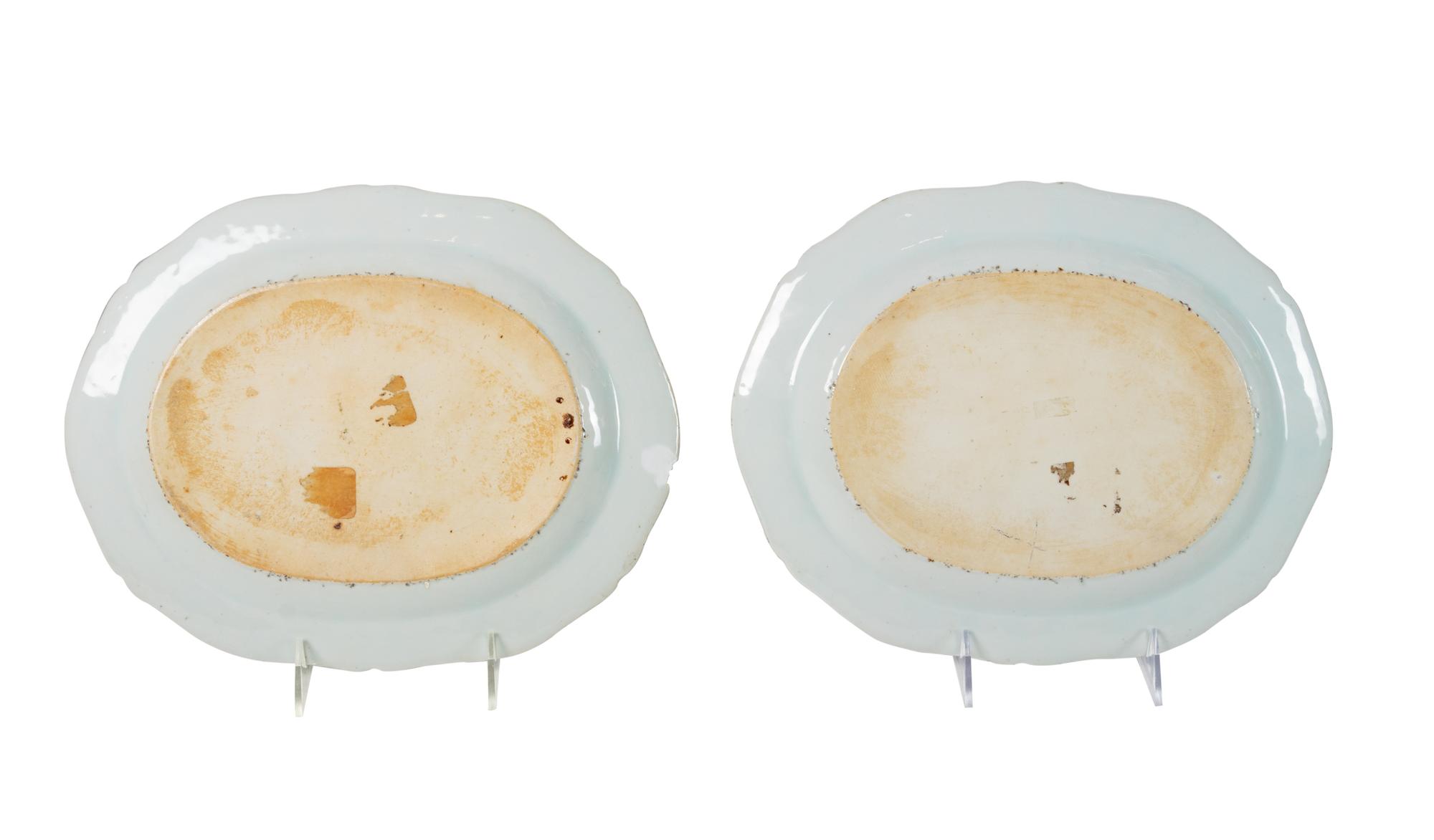 A Pair of Chinese Export Porcelain Armorial Platters Raised on Later Mahogany Stands