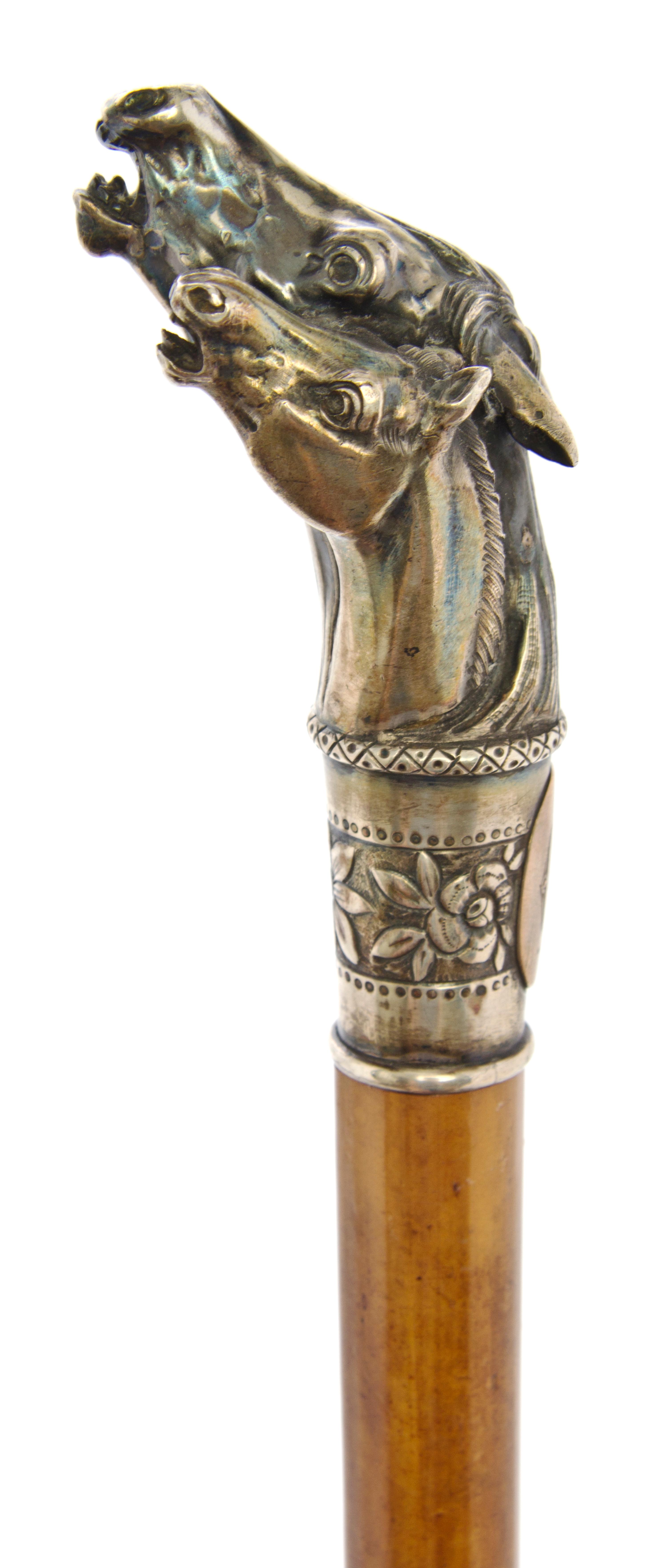 An American Sterling Silver Handled Cane, Length of handle 4 x length overall 30 1/2 inches.