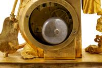 An Empire Gilt Bronze Figural Mantel Clock