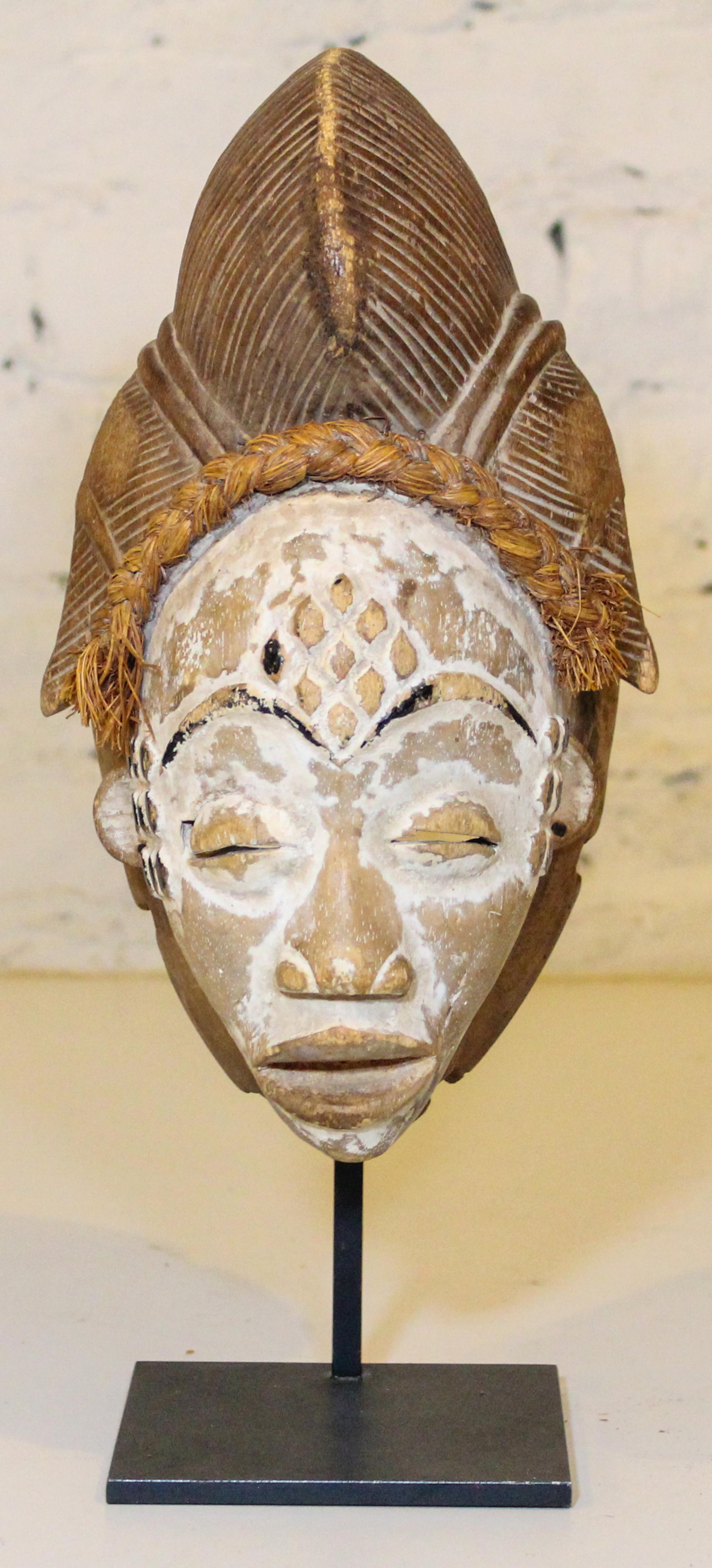 A Baule Style Painted Mask. Height overall 14 inches.