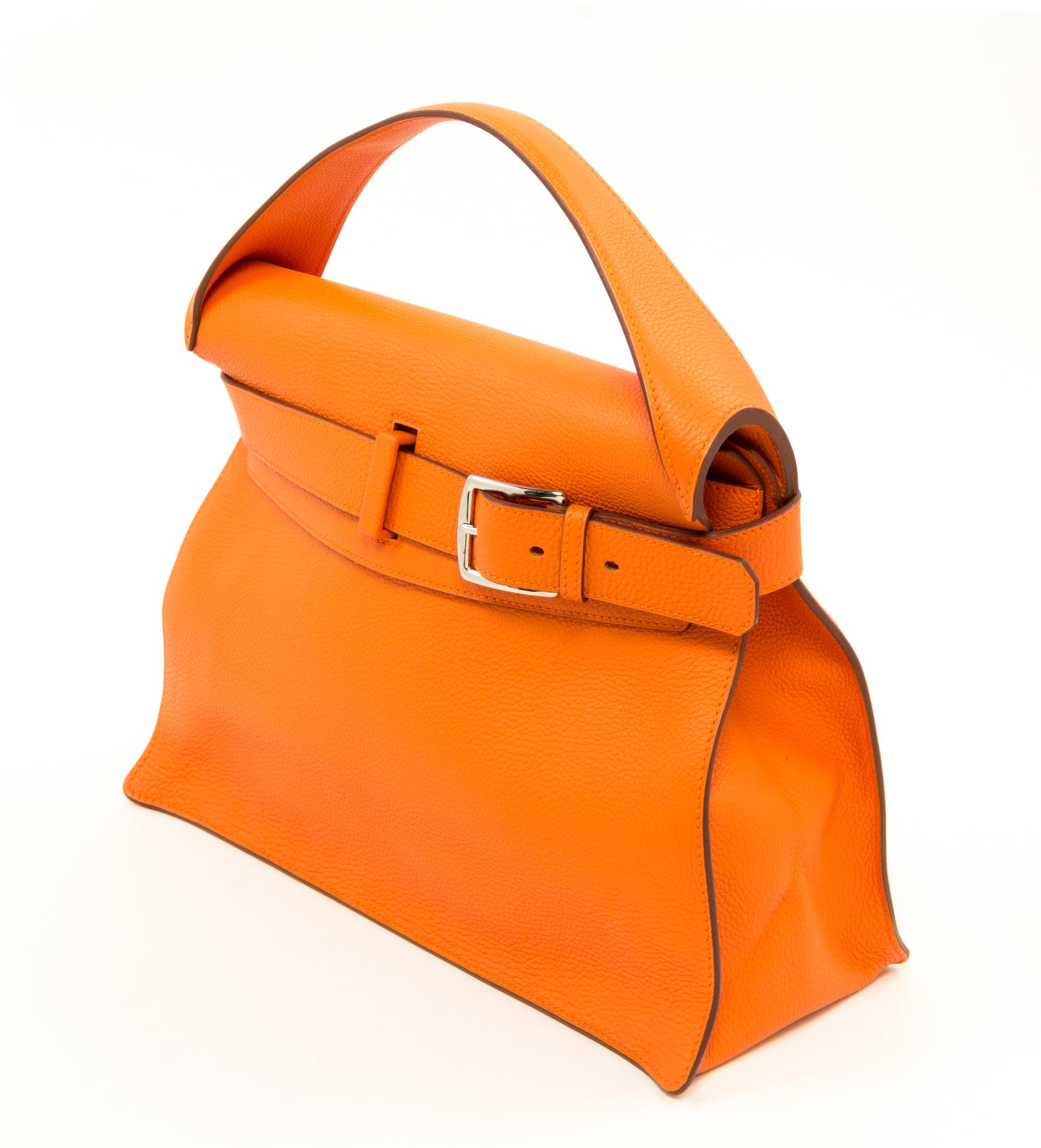 An Hermès Orange Togo Etribelt Handbag, 13.5" x 10.5" x 5"; Handle drop: 3.5".