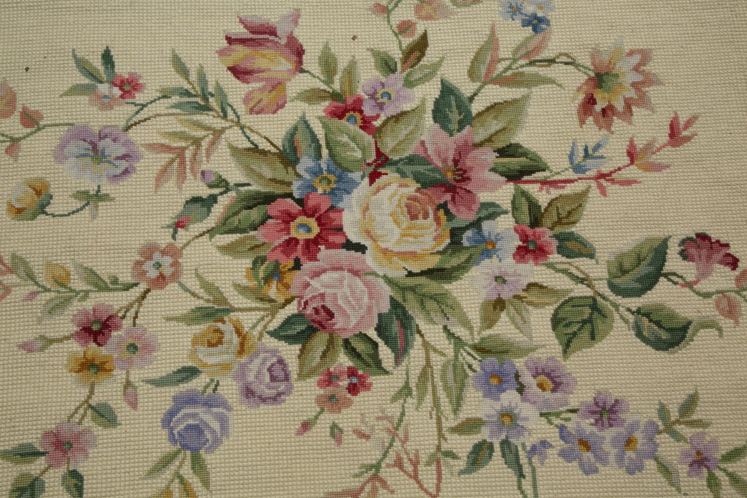 A Large Floral Wool Needlework Rug