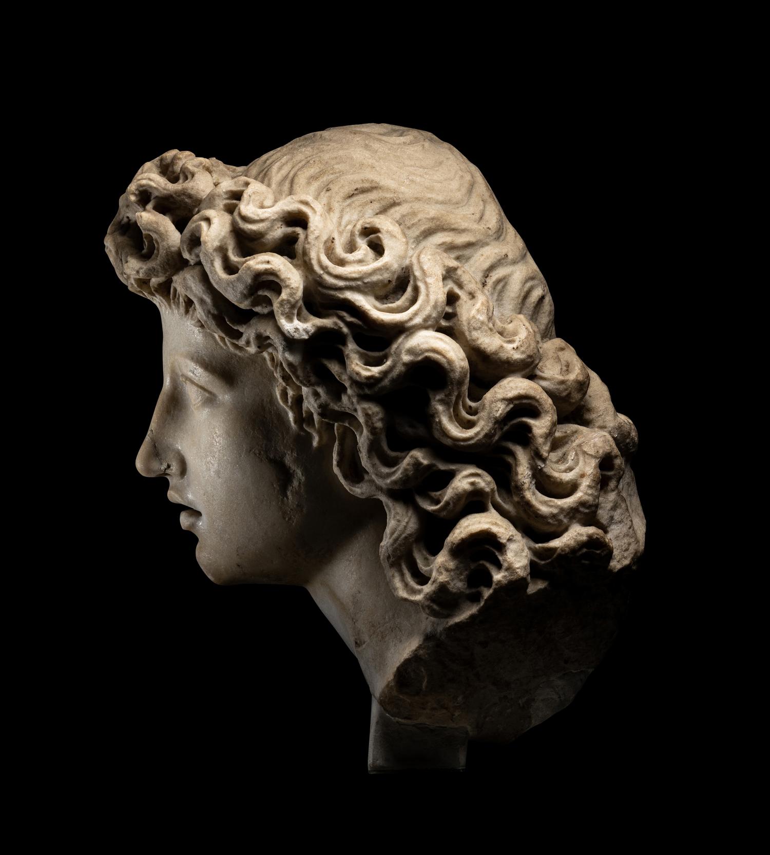 A Roman Marble Head of a Triton
