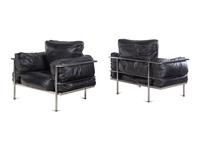A Pair of Leather Upholstered Chrome Lounge Chairs in the Style of Le Corbusier