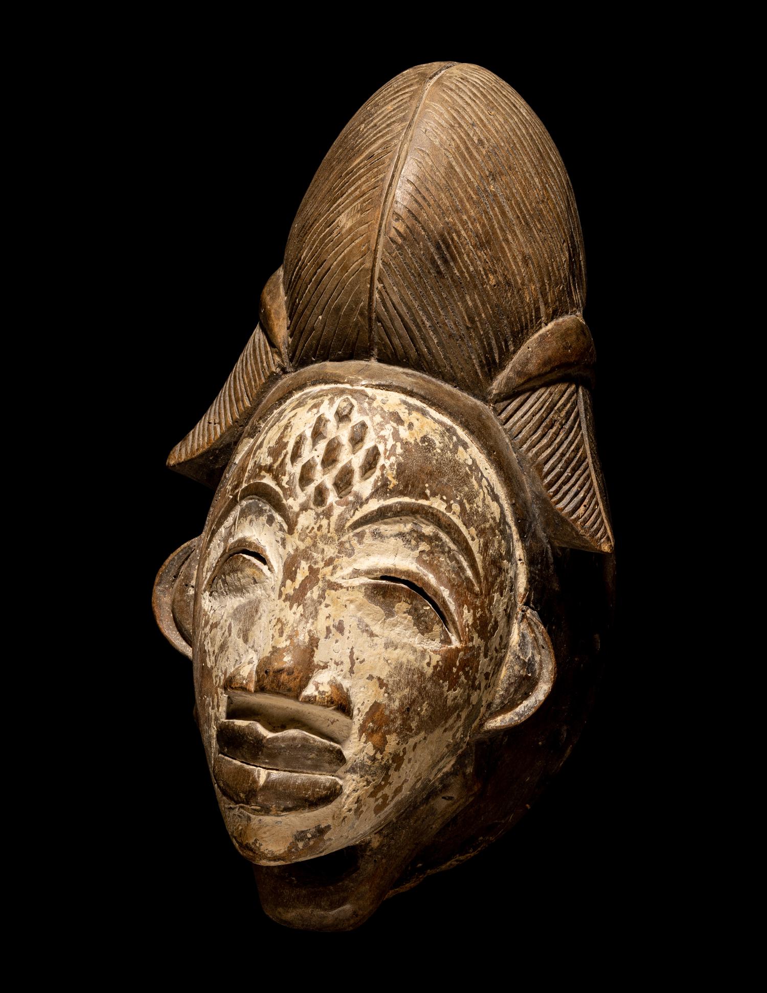 Four Punu Wood Masks