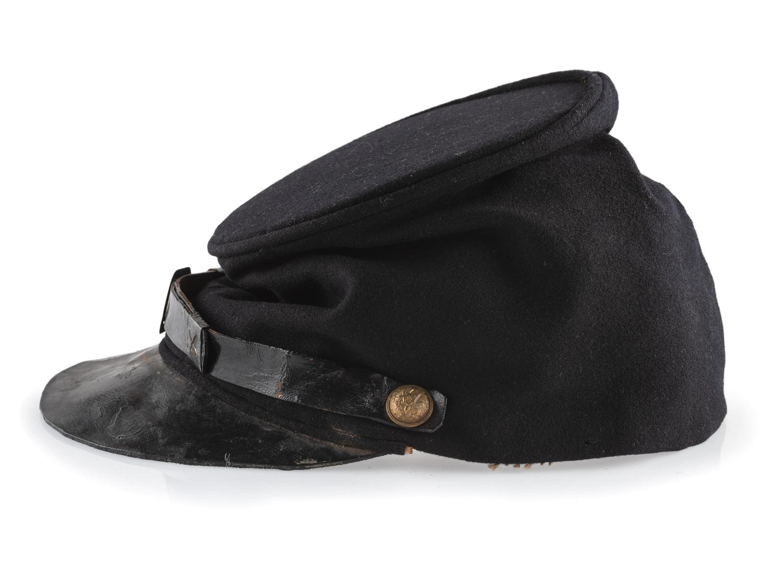 [CIVIL WAR]. A collection of items attributed to Thomas W. Johnson, Co. K, 4th Delaware Infantry, incl. frock coat, cap, belt rig, and cartridge box.