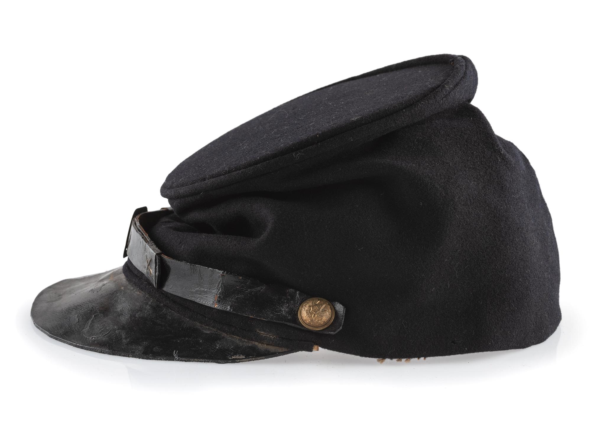 [CIVIL WAR]. A collection of items attributed to Thomas W. Johnson, Co. K, 4th Delaware Infantry, incl. frock coat, cap, belt rig, and cartridge box.