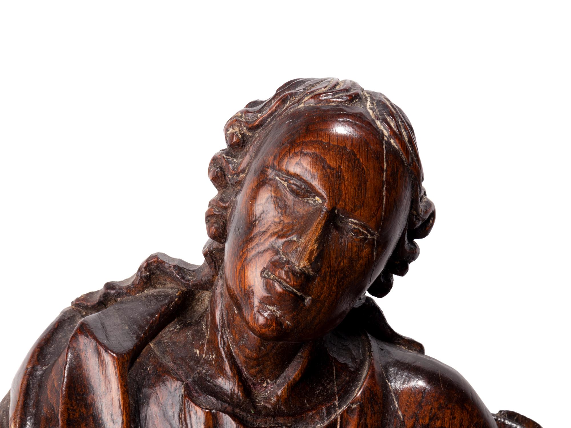 A Continental Carved Wood Figure of a Saint