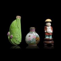 Two Chinese Molded Porcelain and One Enameled Glass Snuff Bottle