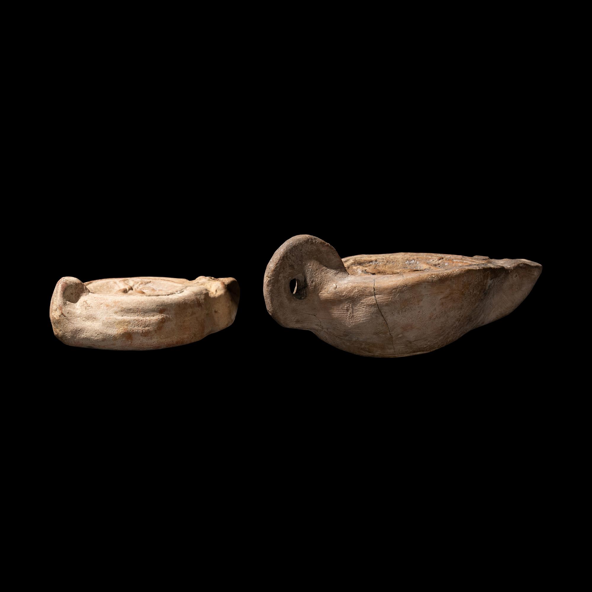 Two Roman Terracotta Lamps with Erotic Scenes