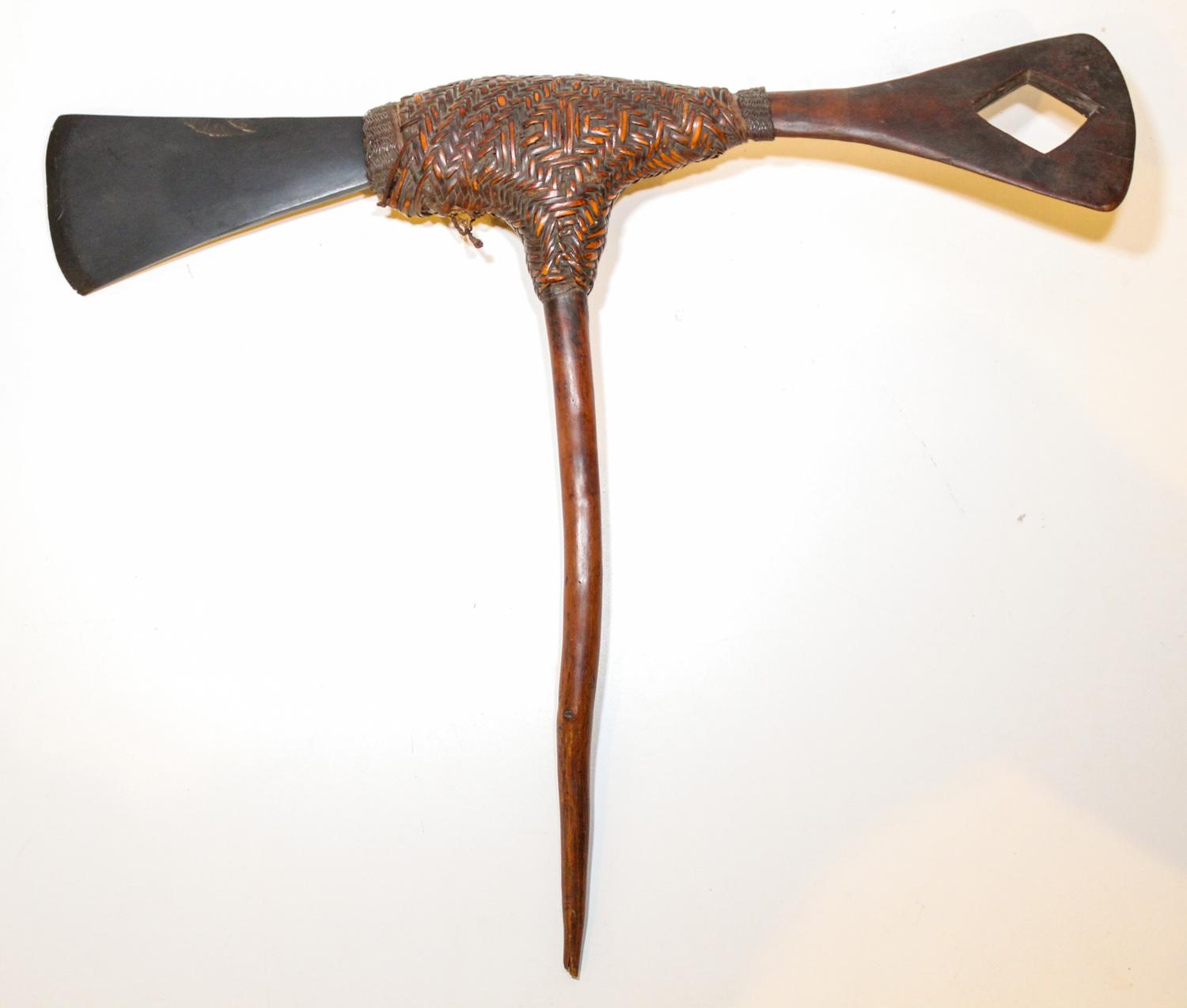 A Stone Axe, New Guinea. Length 18 1/2 inches.
