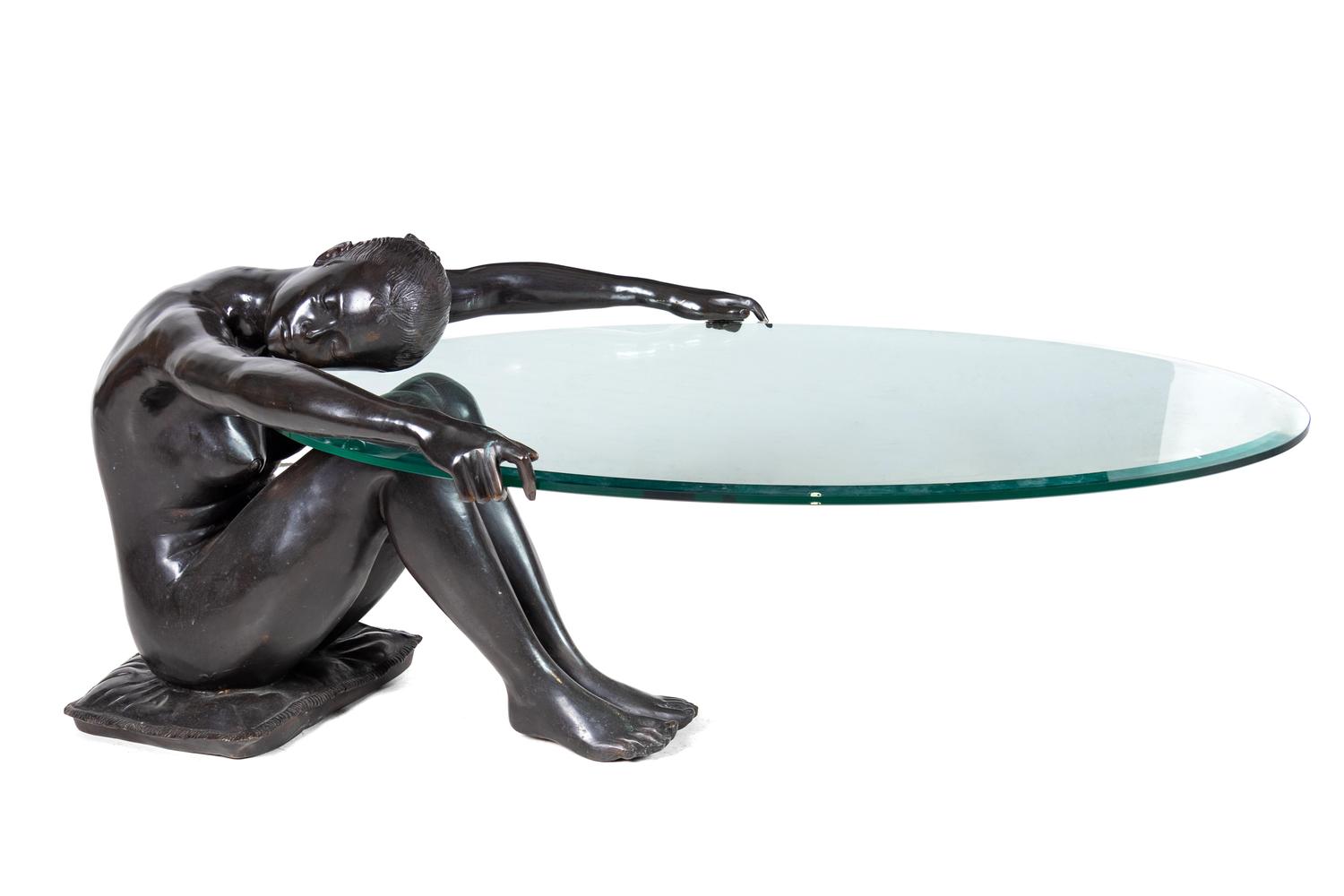 A Patinated Bronze and Glass Low Figural Table