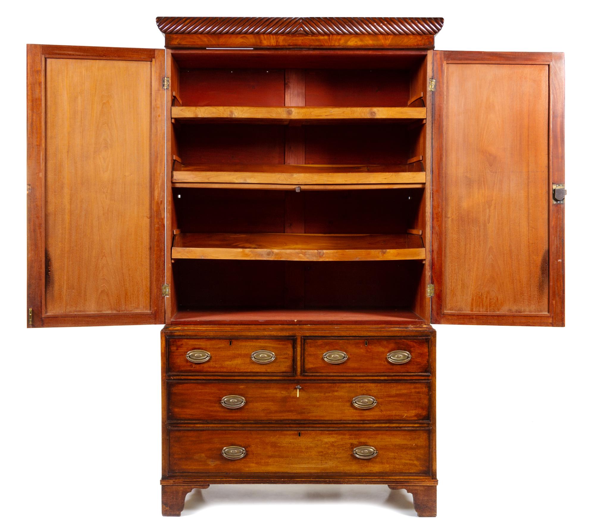 A George III Mahogany Linen Press Height 86 1/2 x width 47 3/4 x depth 20 3/8 inches. — EARLY 19TH CENTURY, THE CORNICE LATER