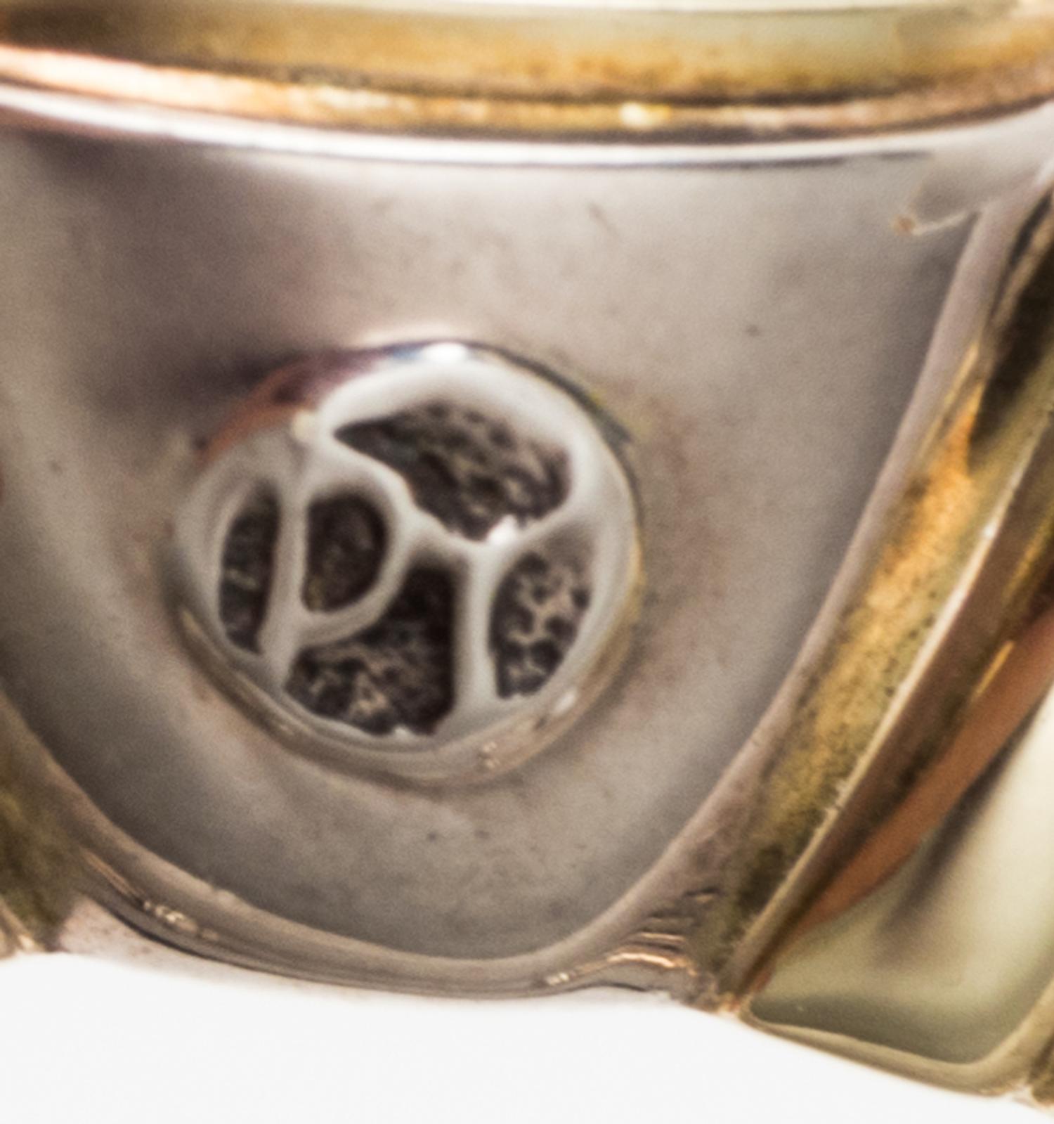 A Sterling Silver, 14 Karat Yellow Gold, and Blue Topaz 'Noblesse' Cuff Bracelet, David Yurman, 31.50 dwts.