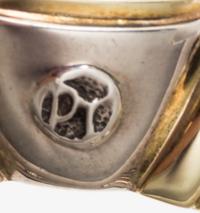 A Sterling Silver, 14 Karat Yellow Gold, and Blue Topaz 'Noblesse' Cuff Bracelet, David Yurman, 31.50 dwts.
