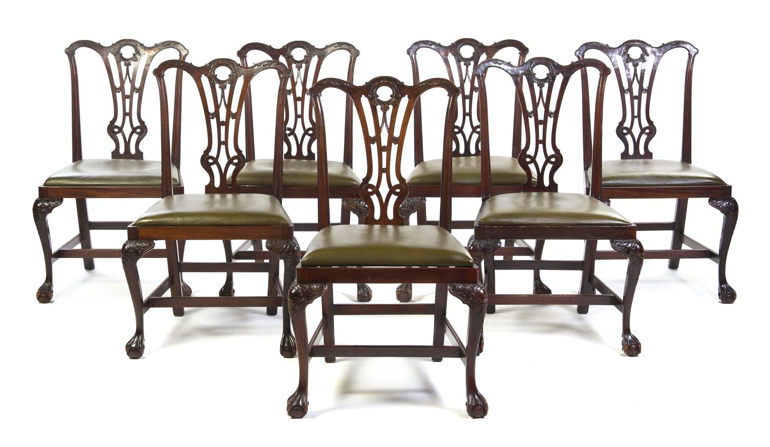 A Set of Seven Irish Chippendale Style Mahogany Side Chairs, Height 38 inches.