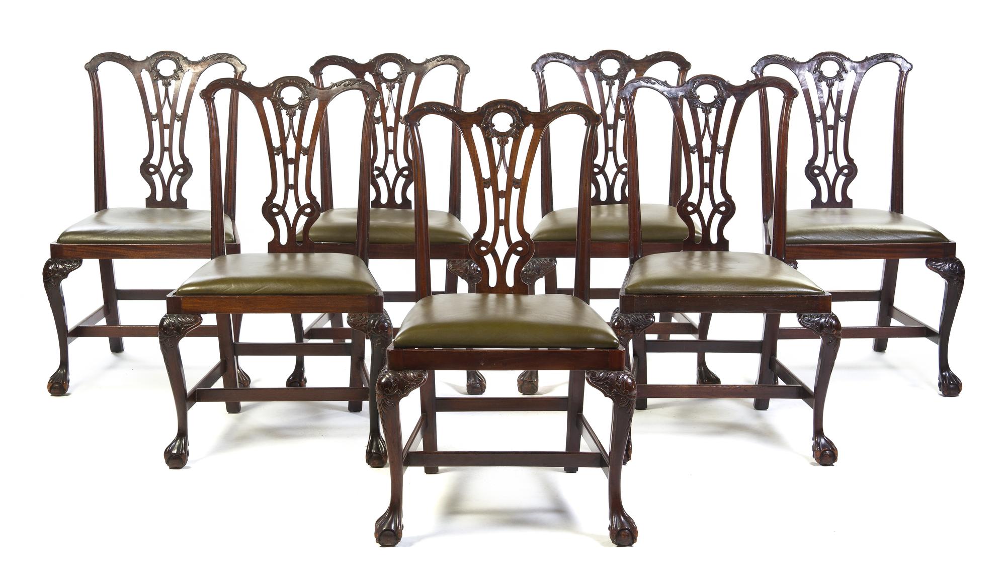 A Set of Seven Irish Chippendale Style Mahogany Side Chairs, Height 38 inches.
