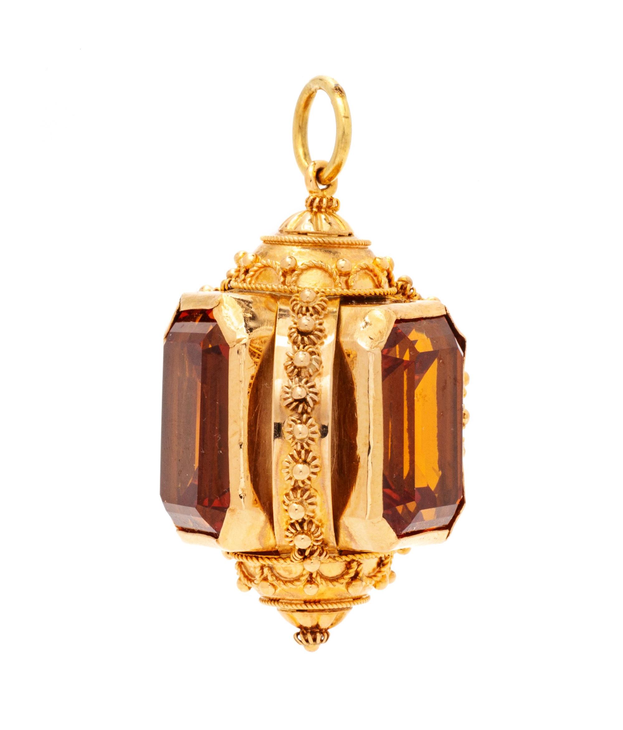 A Rose Gold and Synthetic Orange Sapphire Charm,