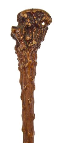 A Carved Wood Walking Stick, Length of handle 3 x length overall 35 inches.