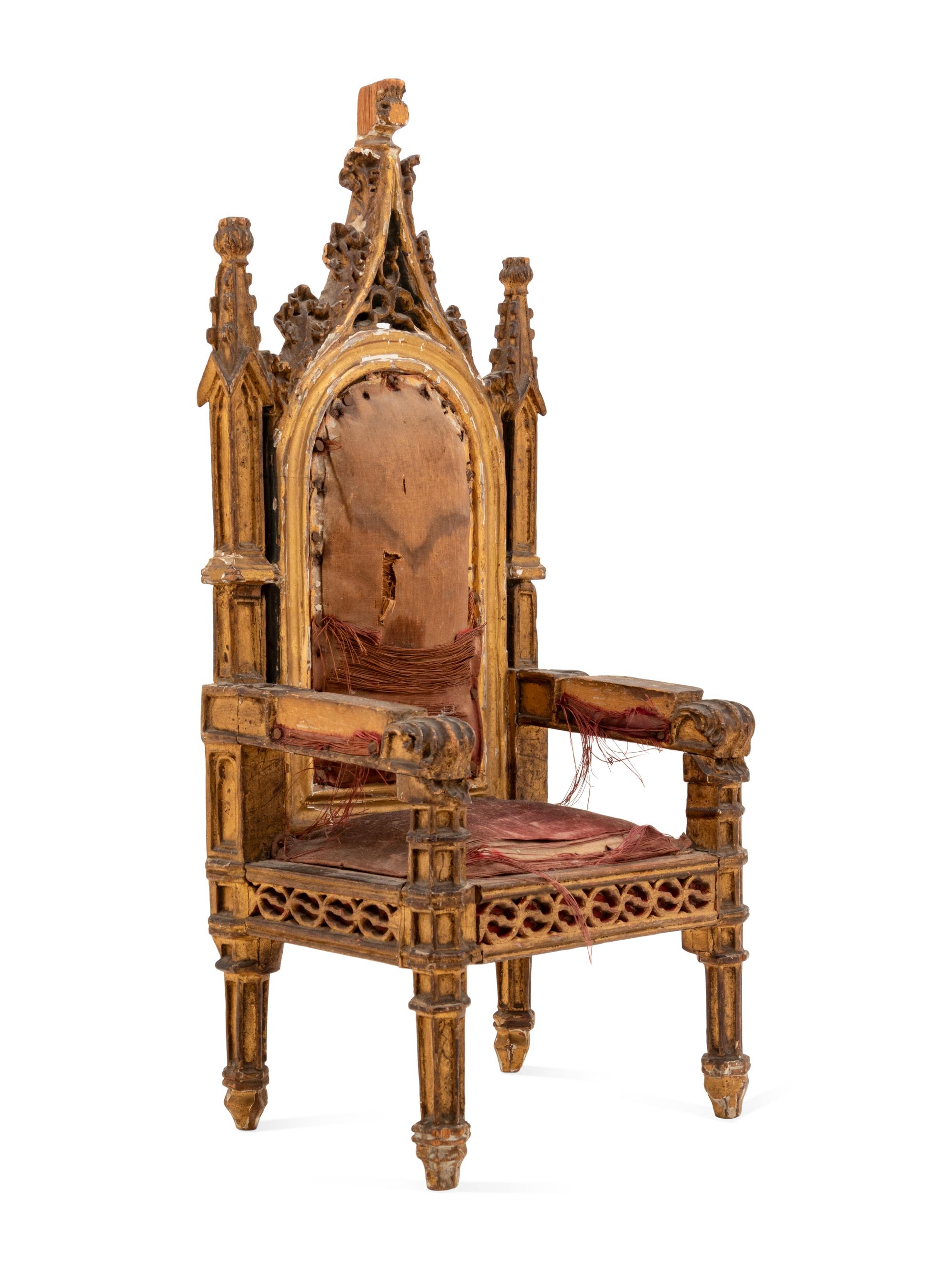 A Gothic Style Carved Giltwood Miniature Armchair