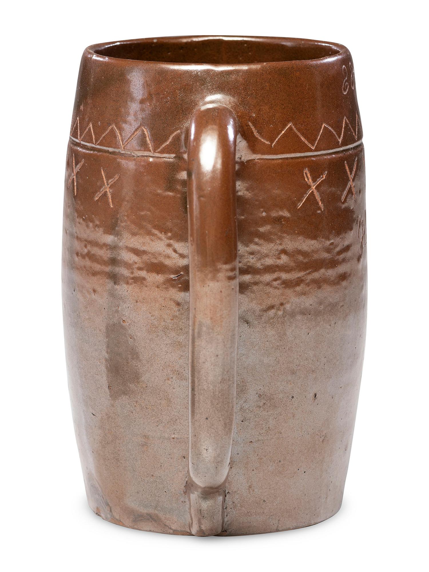 A Heavily Incised Albany Slip-Glazed Stoneware Beer Mug