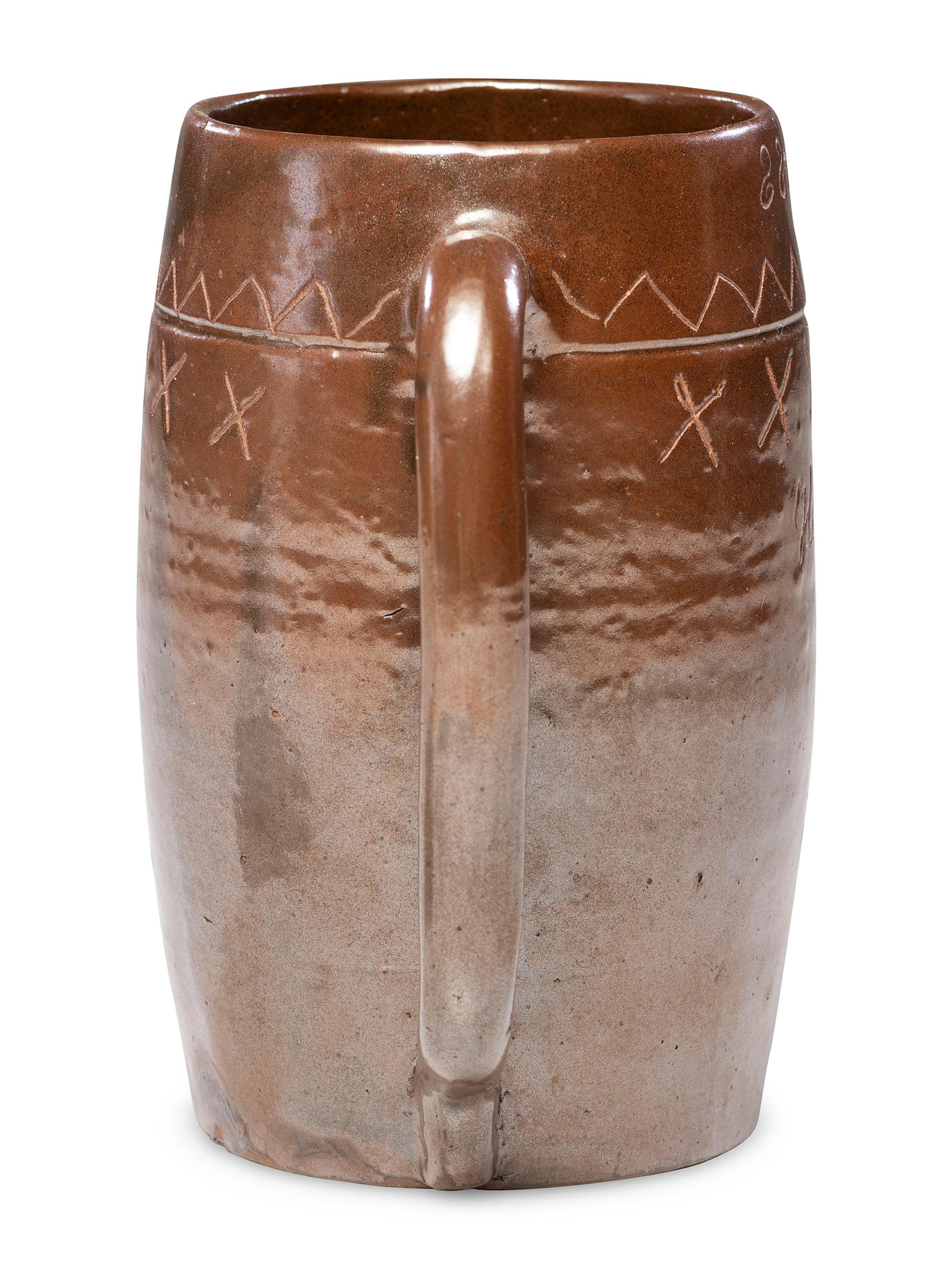 A Heavily Incised Albany Slip-Glazed Stoneware Beer Mug