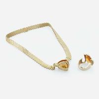 An 18K yellow gold and citrine necklace and topaz ring