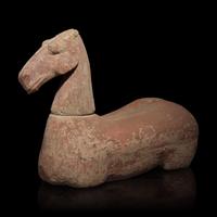 A Chinese Pottery Figure of a Recumbent Horse, Han Dynasty — 漢 彩繪灰陶馬
