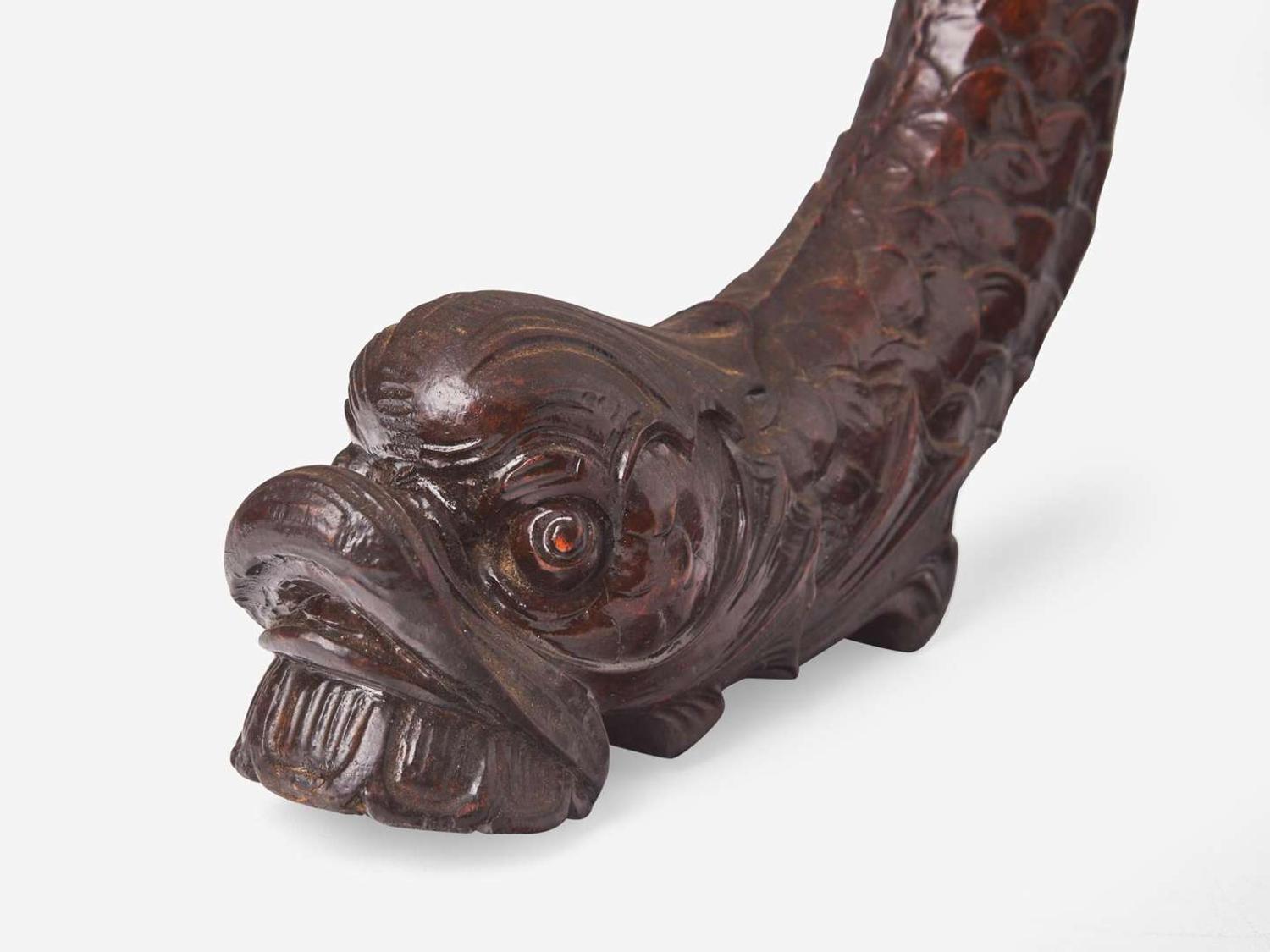A group of three Classical carved mahogany dolphins, possibly Philadelphia, PA, circa 1820-1830