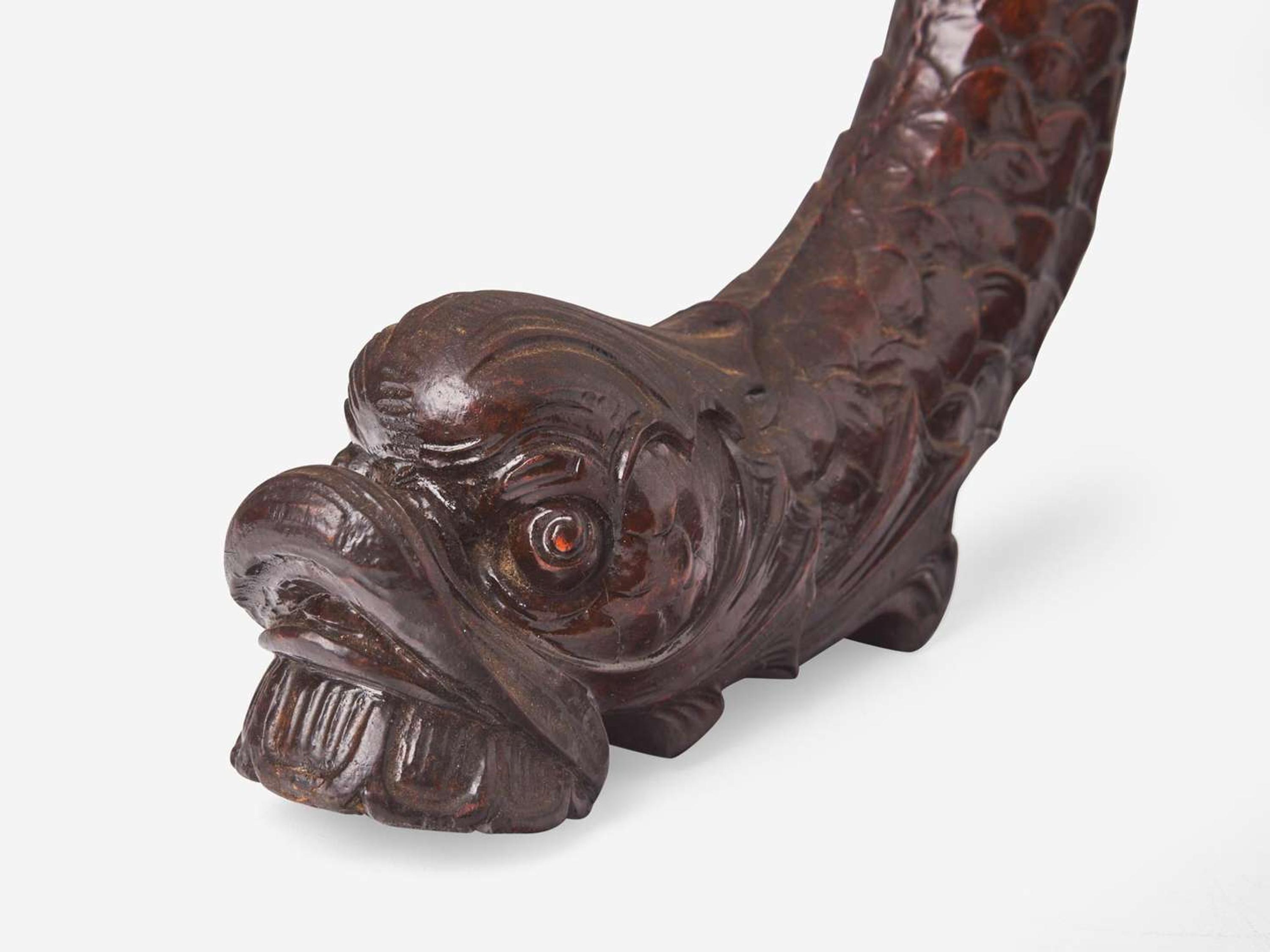 A group of three Classical carved mahogany dolphins, possibly Philadelphia, PA, circa 1820-1830