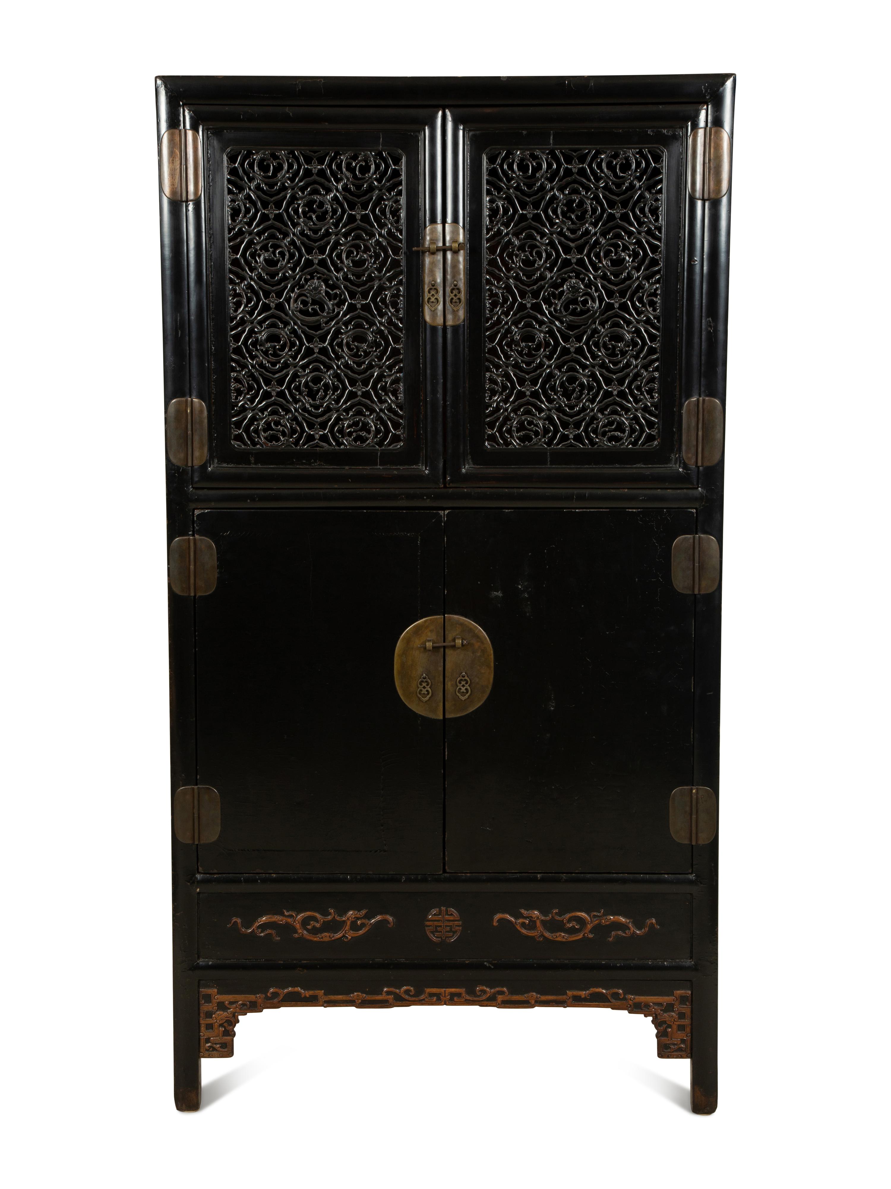A Chinese Black Lacquer Cabinet with Pierce-carved Upper Door Panels