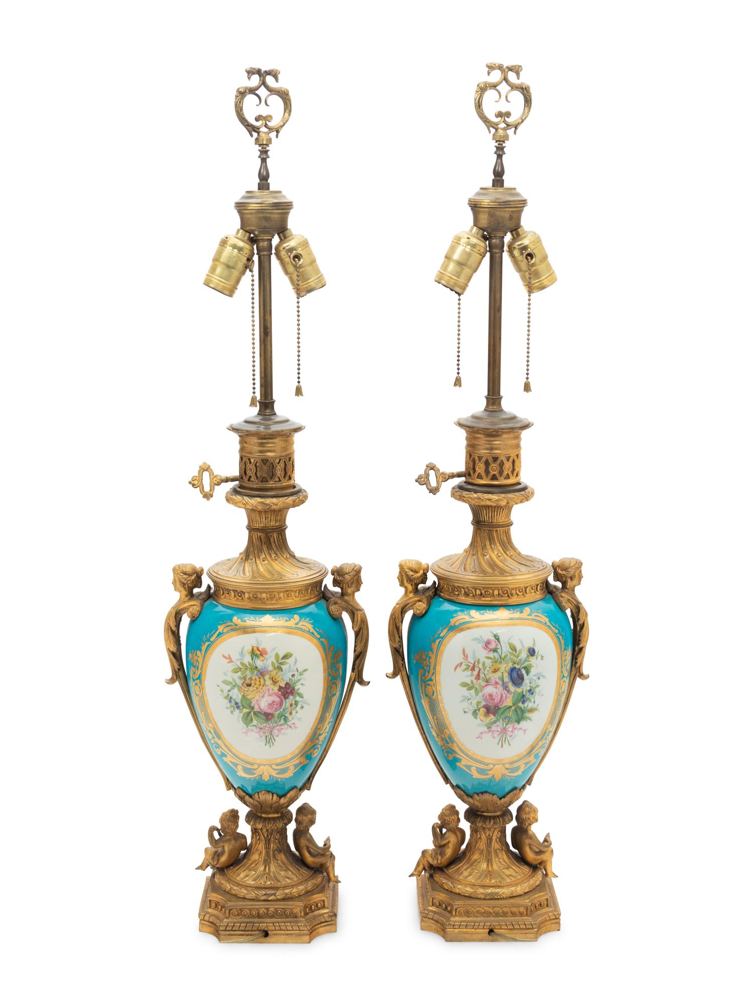A Pair of Sèvres Style Gilt Bronze Mounted "Jeweled" Porcelain Fluid Lamps