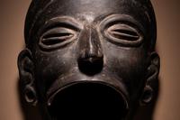 An Olmec Blackware Effigy Vessel in the Form of a Human Face